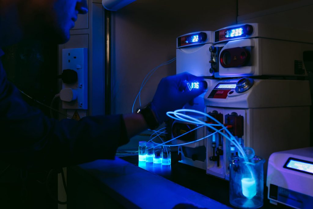 A photograph of a Syrris Asia flow chemistry system being used for fluorescing chemistry