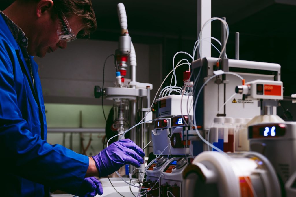 A chemist using Syrris Asia in a lab