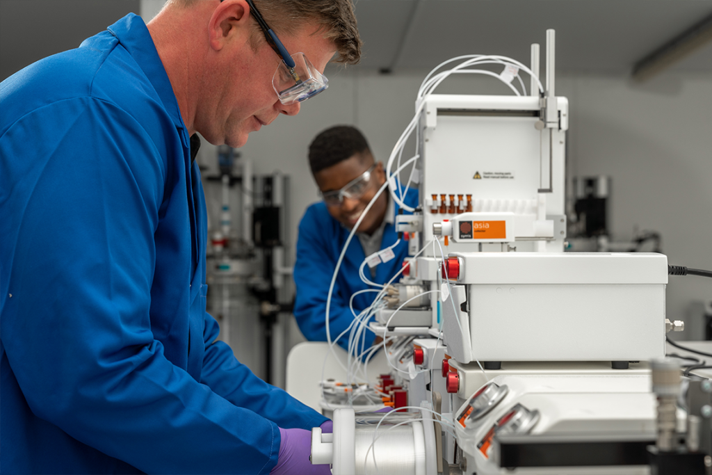 Andrew Mansfield Product Manager of Flow Chemistry at Syrris in the lab with tube reactor